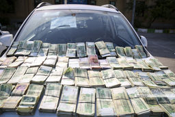 اسکناس های کشف شده از باند مواد مخدر +عکس